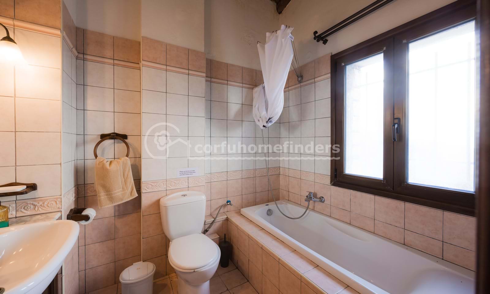 Listing photograph 17 of 20 of the house in Kassiopi, published by Corfu Home Finders.