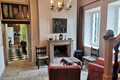 sitting room leading to dining and kitchen