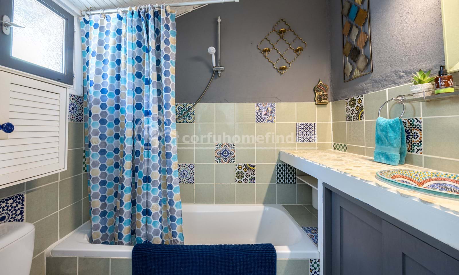 Listing photograph 16 of 18 of the house in Kassiopi, published by Corfu Home Finders.