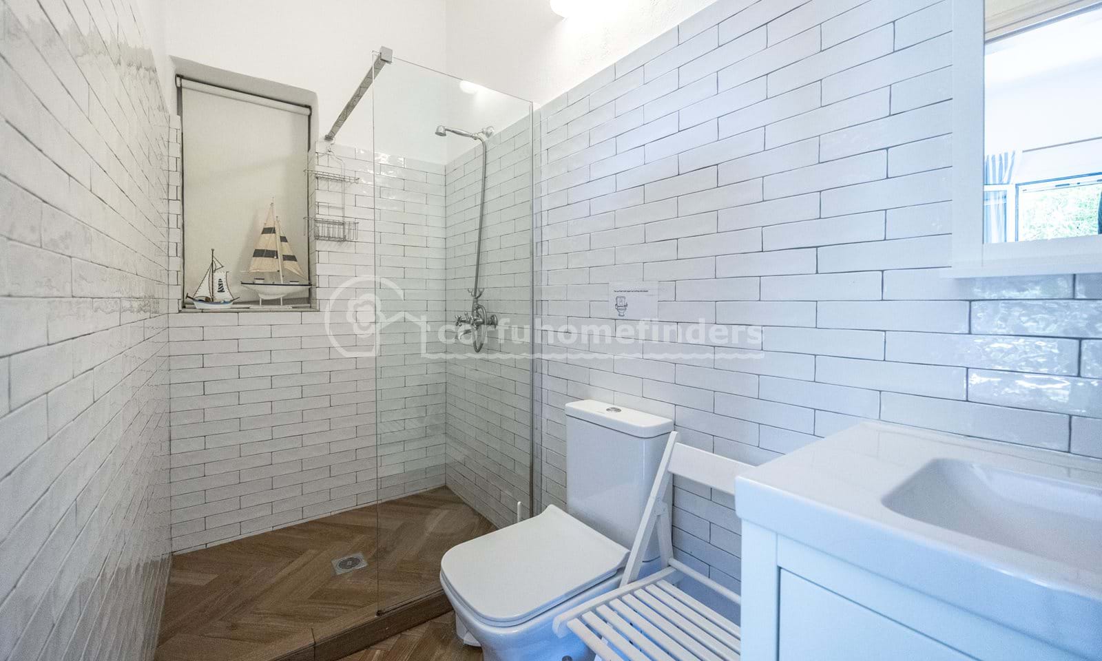 Listing photograph 23 of 28 of the house in Kassiopi, published by Corfu Home Finders.