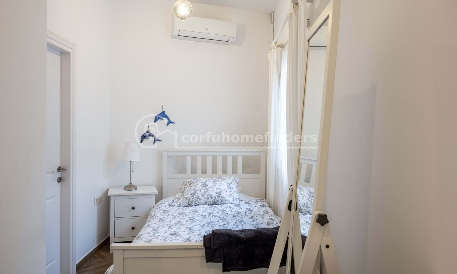 Listing photograph 24 of 28 of the house in Kassiopi, published by Corfu Home Finders.