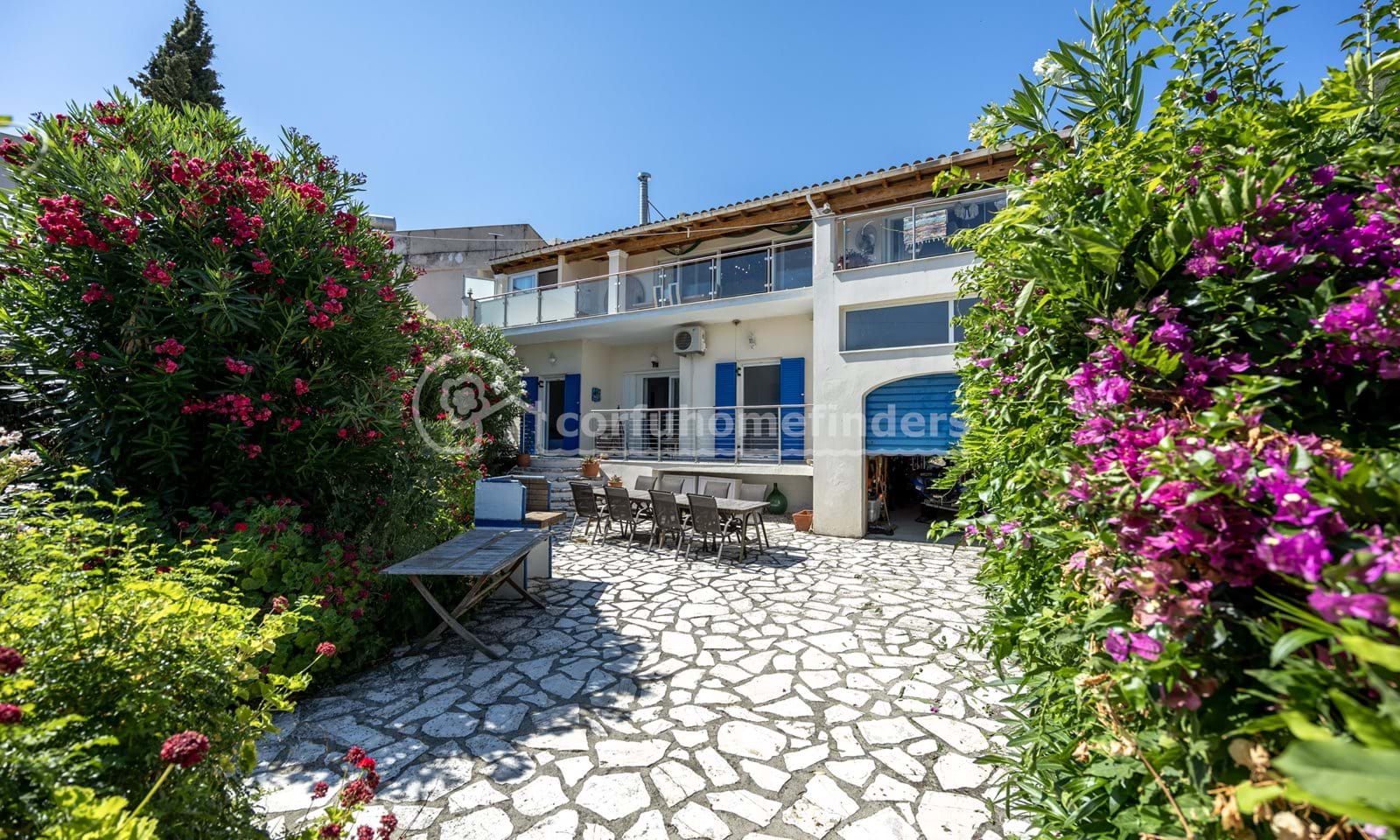 Listing photograph 2 of 28 of the house in Kassiopi, published by Corfu Home Finders.