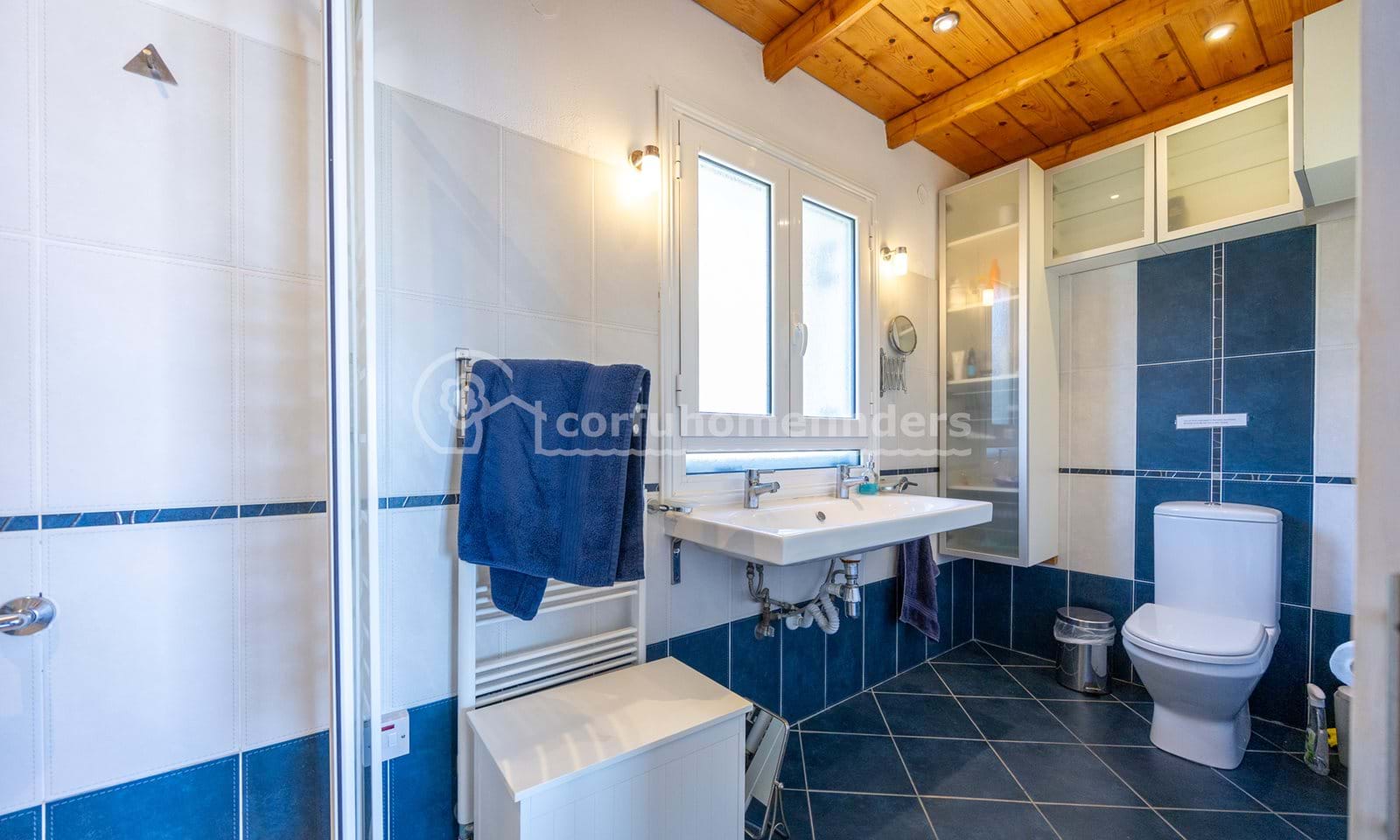 Listing photograph 15 of 28 of the house in Kassiopi, published by Corfu Home Finders.