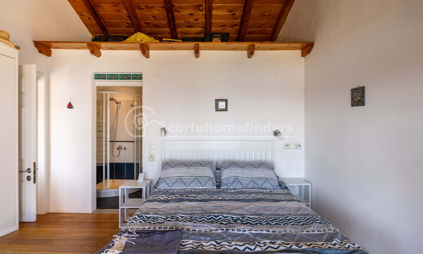 Listing photograph 14 of 28 of the house in Kassiopi, published by Corfu Home Finders.